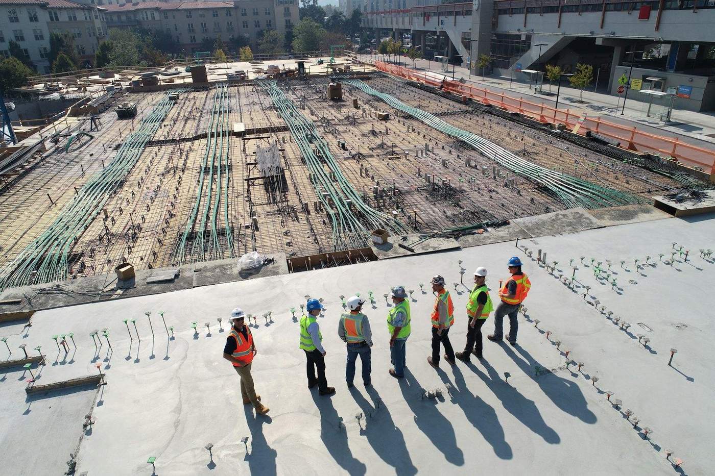 Construction site team reviewing a project — Clear Cost estimating partner